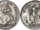a close up of a silver coin with an image of a woman on it