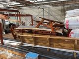 several pieces of wood are stacked on top of each other in a warehouse