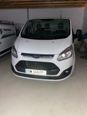 the white van is parked in the garage next to the white van