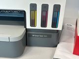 an image of a printer and a cup on a table