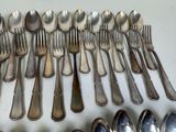 a lot of spoons and spoon spoons on the table