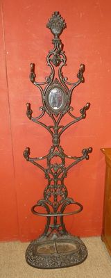 a clock on a stand in the corner of a room