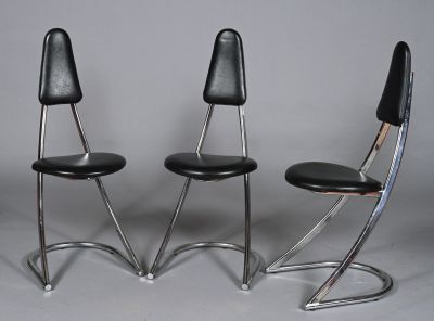 pair of chrome and black leather chairs with black leather seats