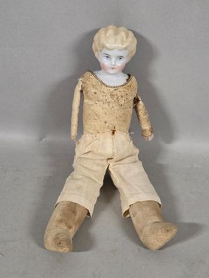 a small doll that is sitting on the floor