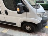 a white van that is parked on the side of the street