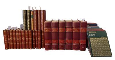a lot of books that are stacked on top of each other