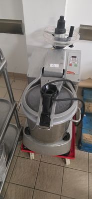 a machine that is sitting on a cart in a kitchen