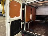 a white van with the door open in a building