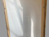 an image of a wooden frame with a glass door in it