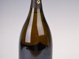 a bottle of wine that is sitting on a table