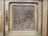 a picture of a wooden door with a picture on it