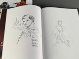 a book with a drawing of a woman holding a gun