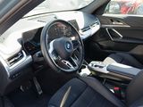 a view of the inside of a car from the driver ' s seat