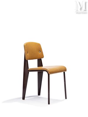 the chair is made of wood and has a brown seat