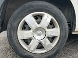 a white car that has a flat tire on it