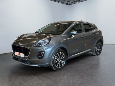 the grey car is parked in a large room with white walls