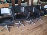 four chairs that are sitting in a row on the floor