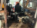 an image of a van that has a lot of stuff in it
