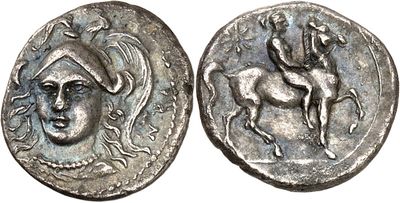 a silver coin with an image of a man on a horse