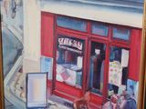a picture of a painting of a storefront on a table