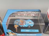 a box with a toy car inside of it on a table