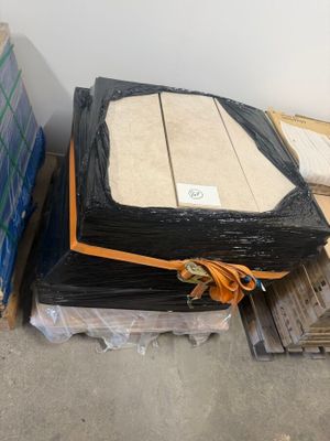 a box of cardboard and a box of cardboard sitting on a pallet