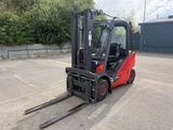 a picture of a forklift parked in a parking lot