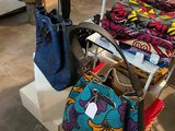 bags and purses are on display in a store