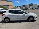a white car parked in a parking lot with other cars in the background
