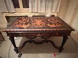 a table that has a brown and black design on it