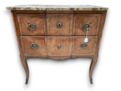 a marble top chest of drawers on a stand