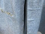 a close up of a jacket with a hole in it