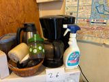 many items that are sitting on top of a refrigerator
