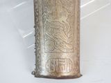 a silver case with a design on it on a white surface