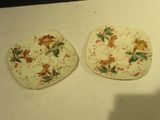 two plates that are sitting on a table