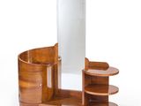 an image of a wooden vanity with a mirror and shelves