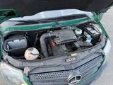 a car that has its hood open with the engine in it