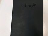 a close up of a cell phone sitting on top of a table