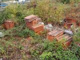 a pile of bricks sitting in the middle of a field