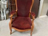 a chair with a red upholstered upholstered seat