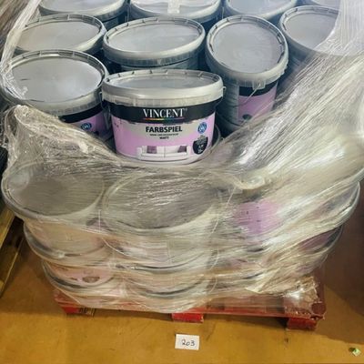 several cans of paint are wrapped in plastic on a pallet
