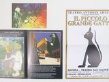many posters on the refrigerator in the kitchen