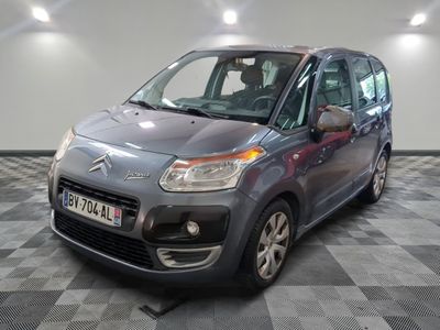 the grey citrole is parked in the garage on a checkered floor