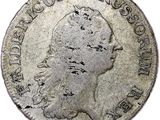 gros plan d'une pièce de monnaie sur fond blanc