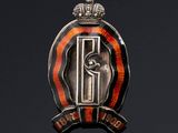 an image of a badge with a crown on top of a black background