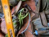 a picture of a pile of wires and tools on the floor