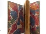 an open book with a floral design on it