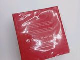 the back of a red plastic box with a label on it