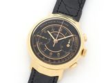 a close up of a watch on a white surface with a black strap