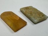 two soap bars sitting next to each other on a table